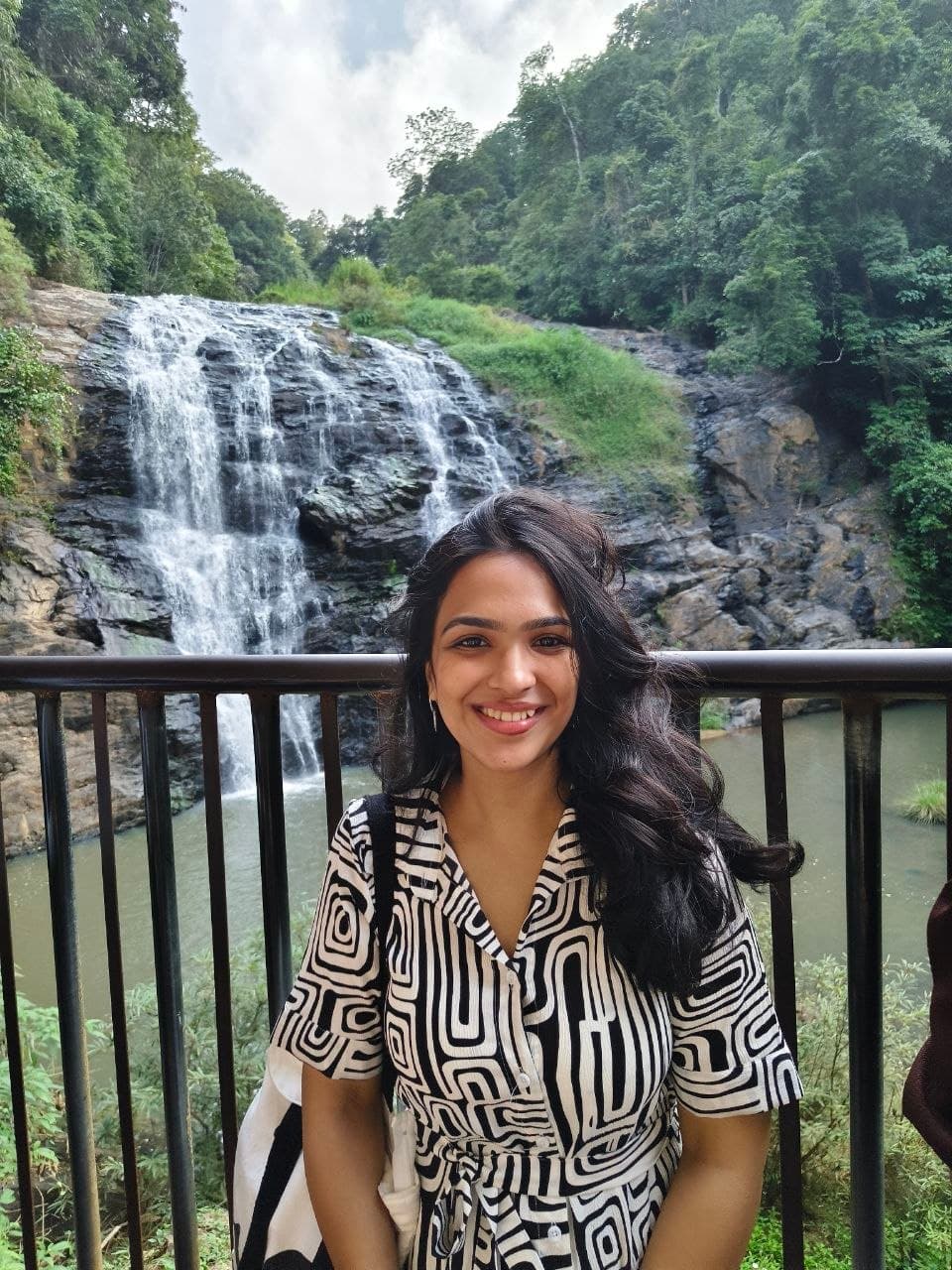 Manya Jain — portrait against a soft nature backdrop